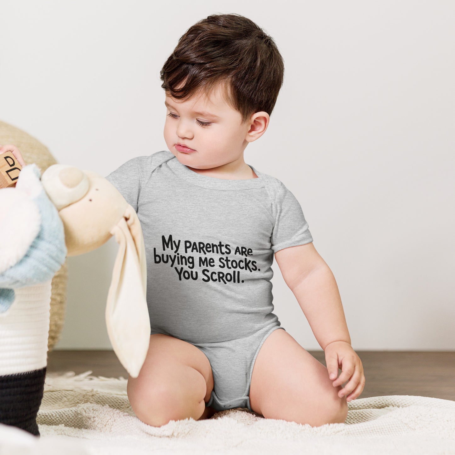 Baby bodysuit with the words My parents are buying me stocks