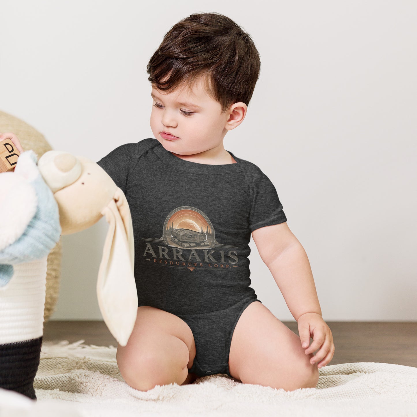 Baby bodysuit with a fictional mining company logo for Arrakis Resources Corp