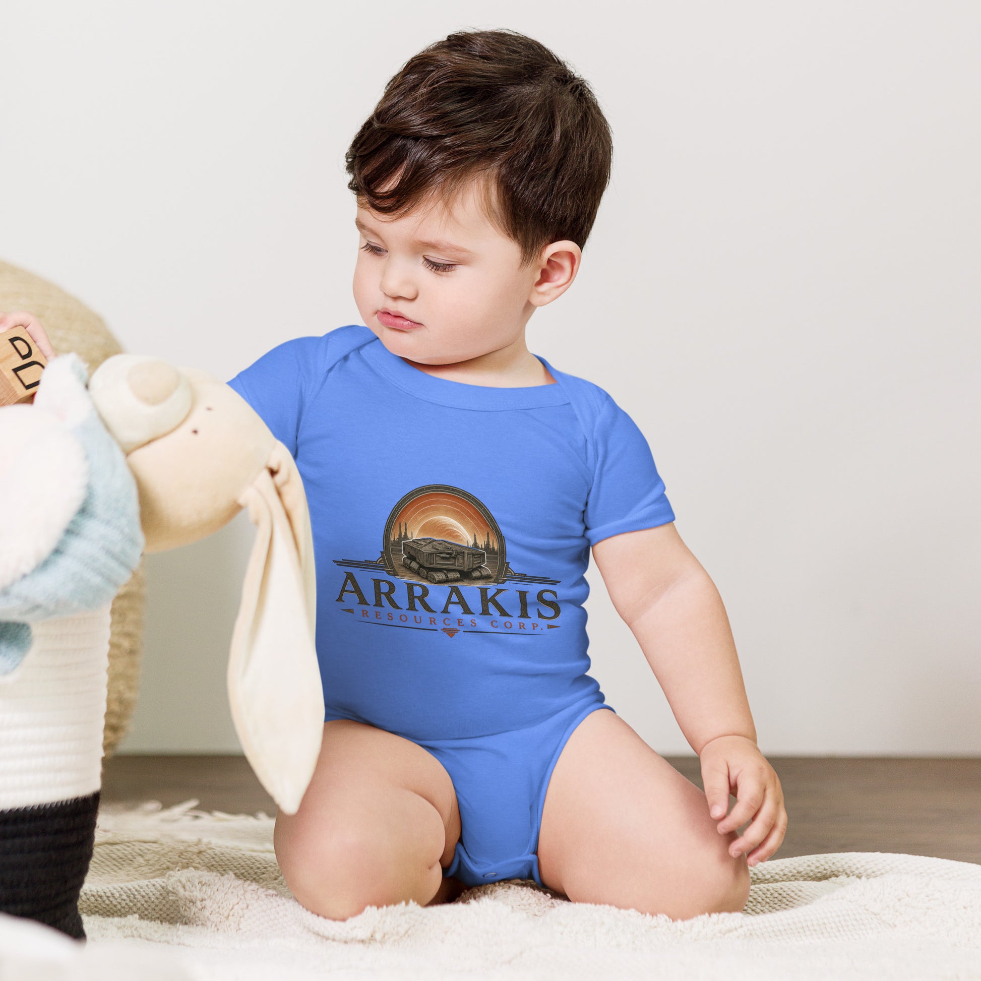Baby bodysuit with a fictional mining company logo for Arrakis Resources Corp