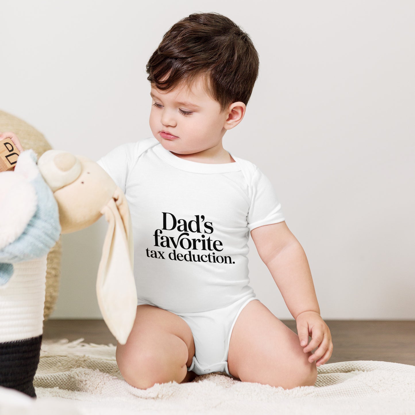 Baby bodysuit with the words Dad's favorite tax deduction