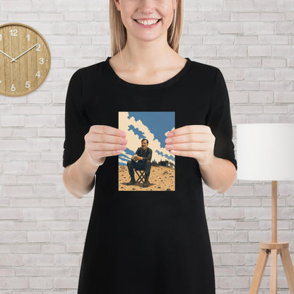 Matte poster with illustration of an oil-splattered man in a suit smoking a pipe, seated on a folding stool in a desert oil field beneath a wide sky